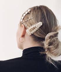 The pearl hair clip is now trending and if you're in need of a few ways to style your hair with this hot new trend, this video will show you how. Pearl Clips Gold Hair Accessories Hair Accessories Beaded Hair Clips