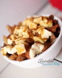 This dish consists of chips (or french fries) topped with fresh cheese curds 2, covered in brown gravy and served steaming hot. Quebec City S Best Poutines
