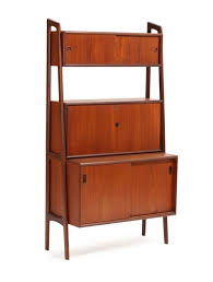 Before applying teak sealer, you should thoroughly clean your teak furniture. Lot Art Danish Furniture Design A Teak Wall Unit With Two Cabinets With Sliding Doors And A Cabinet With Writer S Desk H 170 W 90 D 23 45 Cm