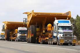Tri Drive Mack Titan With A Caterpillar 785c Dump Truck Trucks Giant Truck Mack Trucks