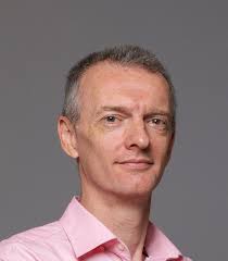 Introduction to automated design of scheduling heuristics with genetic  programming