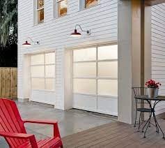 Check spelling or type a new query. Just Right In White Modern Glass Garage Doors Look Right At Home On This Contemporary Farmhouse In Fl The Red Gooseneck Lamps Add Fun C Le Chateau Conte