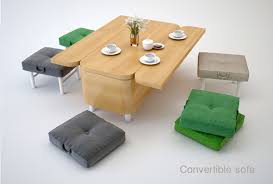 It has a smooth, gray laminate top and black metal, open frame legs. Convertible Coffee Table Sofa Dining Room Table Stools Boing Boing