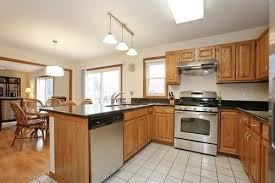 Sage green kitchen with oak cabinets. How Do I Downplay Honey Oak Cabinets On A Budget