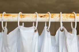 Wash them — along with a couple of bath towels (to prevent the plastic curtains from crinkling) — in warm water with 1/2 cup chlorine. How To Clean A Shower Curtain Without Taking It Down