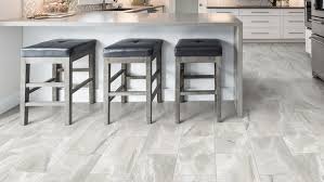 Travertine flooring in a luxury vinyl tile — good for a 1960s or 1970s house. Vinyl Sheet Tarkett