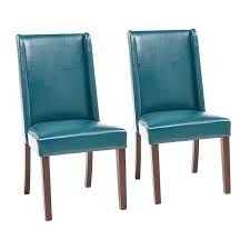 The Classic Wingback Chair Soars Into A New Era Our Dining Chair Features Modified Flat Wing Faux Leather Dining Chairs Leather Dining Chairs Dining Chair Set