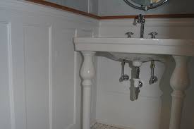 It is topped off with a chair rail, which is a horizontal strip of molding that spans the circumference of a room. Custom Wainscoting Bathroom Picture Ideas