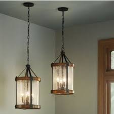 Kichler Barrington Distressed Black And Wood Tone Rustic Seeded Glass Cylinder Pendant Light Lowes Com Rustic Pendant Lighting Wood Pendant Light Rustic Light Fixtures