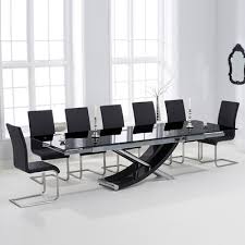 Give your dining room a glam update with the. Hanford Black Glass Extending Dining Table With 12 Milan Black Chairs