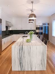 Black with marble finish top storage kitchen island with 2 towel bars. 36 Marbled Countertops To Ignite Your Kitchen Revamp