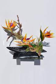 Shop Artificial Orange Bird Of Paradise And Wood Floral Arrangement W Moss And B Artificial Flower Arrangements Artificial Flowers Wedding Floral Arrangements