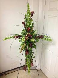 Cross funeral flowers represent what is loving and holy. Pin By Anna Howard On Brandi S Botanical Designs Funeral Flower Arrangements Funeral Flowers Funeral Floral Arrangements