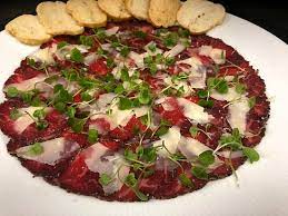Scatter the beef evenly with the raw and pickled shallots, the raw and pickled cucumber, and the pepper flowers. Wagyu Beef Carpaccio Picture Of Ember Grille Wine Bar Lake Charles Tripadvisor