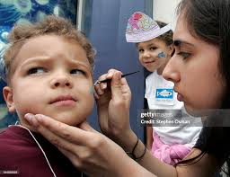 Nicholas Vitzelio 3, of Riverside, has a shark painted