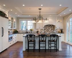 This kitchen boasts walnut finished cabinetry, blinds, kitchen counters and floors, all matching the beams on the ceiling. Tray Ceiling To Denote Each Room Kitchen Ceiling Design Traditional Kitchen Renovation Kitchen Ceiling