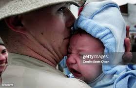 Laura Ludolph hugs her boyfriend, Sgt. Dave Wetherell of the Illinois...  News Photo