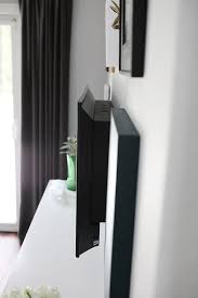 This is possible if the back of your tv or its mounting bracket has some places to thread. Hide The Cables Behind A Wall Mounted Tv