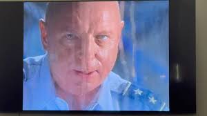 How does the iris in Stargate SG1 work with the wormhole?