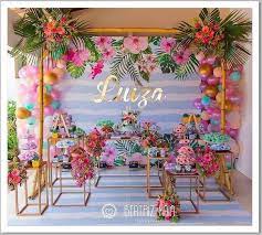 Making a striped backdrop is as simple as taping streamers to your wall. Tropical Party Photobooth Backdrop Ideas