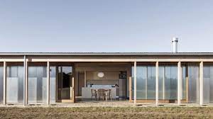 Coniferous trees are usually used in the surrounding landscaping, adding to the woodsy feel of the architecture. Lovell Burton Uses Agricultural Materials For Shed Style Springhill House