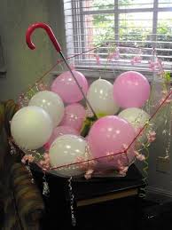 This cute foil balloon is printed with colourful umbrellas and polka dots around the words baby shower, on a white background with a yellow border. Paper Parasols At Hobby Lobby Used Like This Or Suspended From Ceiling Baby Shower Decorations Baby Shower Baby Shower Centerpieces