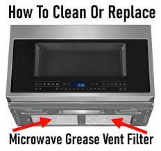 Discard the old grease filter. How To Easily Replace A Microwave Grease Vent Filter