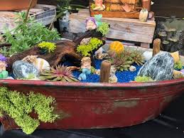 Let your garden be the one to remember. Set Of 3 Rustic Metal Boat Planters Shelves