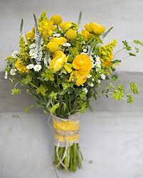 These easter flower arrangements also come in a wide array of colors; A Casual Outdoor Yellow And White Wedding In Maryland Yellow Bouquets Wildflower Bouquet Bridal Bouquet