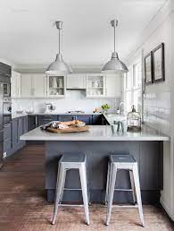 Blue and white transitional kitchen with shades. Mid Blue Grey Kitchen Cabinets With White Uppers Est Magazine Cuisine Moderne Cuisines Maison Cuisines Design