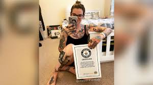 I'm getting pretty tired of always hearing about the meaning behind tattoos. Meet The Woman With Enough Eminem Tattoos To Set A World Record Cnn