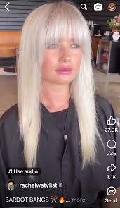 Face-framing platinum pops paired with deep brunette and tousled  layers—bold contrast, major style. What do you think of this look?