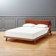 Drommen Acacia Bed With Leather Headboard Cb2 With the malm you have to reach between the wood and the bed and pull it out.
