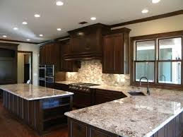 white ice granite dark cabinets