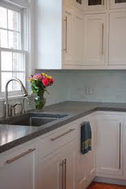 Concrete gives spaces a more industrial look, so avoid any cabinets that look country or are too ornate. Concrete Counters White Shaker Cabinets Stainless Hardware Sink And Faucet White Shaker Kitchen Shaker Kitchen Cabinets White Shaker Kitchen Cabinets