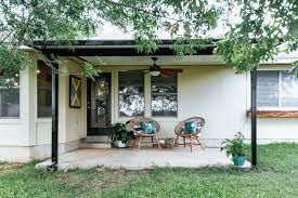 Stone, masonry and wood living spaces rise to a glass and aluminum hanger structure that is linked by a linear monolithic wall. How To Transform An Ugly Metal Patio Cover Love Renovations