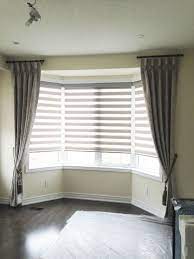 Maybe you would like to learn more about one of these? Side Panel Drapes Can Be Used To Frame Bay Windows As Well This Helps Hide The Sharp Edge Between B Bay Window Living Room Bay Window Drapes Bay Window Blinds