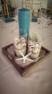 Simple But Cute Beach Themed Centerpiece Cylinder Vases Beach Shell And Sand Centerpiece Tal Sand Centerpieces Beach Theme Centerpieces Beach Wedding Tables