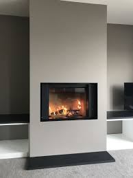 stuv micro mega and feature wall fitted in cornwall wood burning stove installation from kernow fire fireplace feature wall stove installation fireplace design