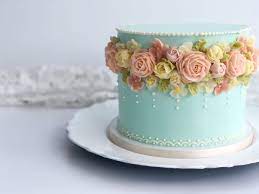 Buttercream flowers in pretty pastels create a garden of sweetness on this cake that's perfect for bridal showers, weddings, easter or mother's day. February Cake Decorator Spotlight Buttercream Cake Designs Cake Decorating Designs Cake Decorating Frosting