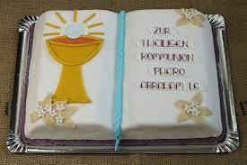 zur ersten heiligen kommunion eine schone fondanttorte als buch kommunion torte kommunion kommunionkuchen