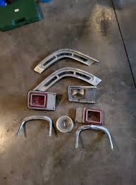 My Dad was a Mopar guy I found these items going through a box in his  garage any ideas what they could be from? The taillights sort of look like  a 64