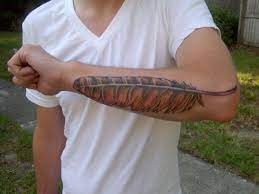 Bird feathers tattoo on neck. Feather Tattoos Designs Ideas And Meanings Tatring