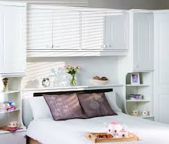 The living room is often the center of a home, but if your space could use some extra square footage, there are plenty of ways to make a small living room feel larger. Amazing Storage Above Bed Ideas Creative Modern Designs Bedroom Wall Storage Sfwiz Co Us Furniture And Home Bedroom Wall Modern Bedroom Design Bedroom Design