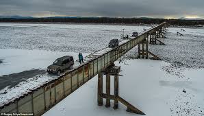 I guess, necessity is the mother of all invention and i am sure this is a certain luxury especially from motorcycle fans. Kuandinsky Bridge In Russia That Daredevils Have To Repair As They Go Daily Mail Online