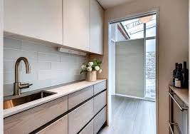 Another popular modern kitchen cabinet base colour can be customized with eggplant with the touch of white on the top row. Two Tone Mid Century Modern Kitchen Crystal Cabinets