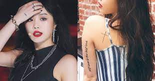 There is a cross on her left shoulder, a cherry close to. G I Dle Soojin S 8 Dainty Tattoos Will Inspire You To Finally Get One Koreaboo