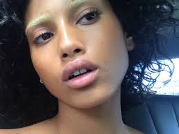 I have black eyebrows, but when i fill my eyebrows in i just use a dark brown. Imaan Hammam Bleached Eyebrows Vogue Arabia
