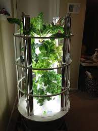 My Indoor Tower Garden With Grow Lights Moves Outside In The Summer Indoor Garden Unique Gardens Luxury Garden