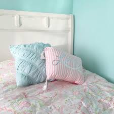 This bedroom proves the power of paint + wood trim to create an accent wall that'll wake up any bedroom's style. Sherwin Williams Tame Teal Paint Wall Color Blue Room Paint Girl Room Room Wall Colors